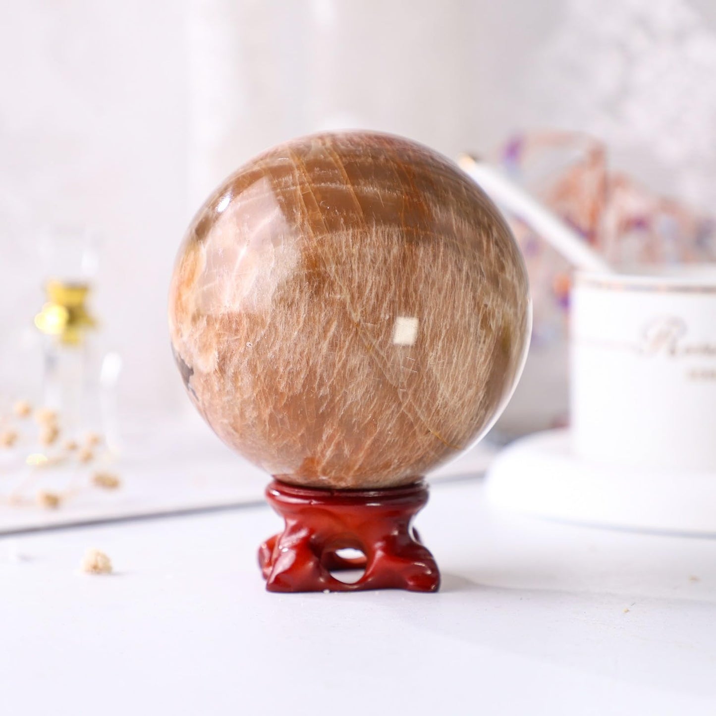 Nupuyai Natural Orange Moonstone Crystal Ball with Resin Stand, Healing Crystal Sphere for Home Decor 2.8"-3.15"(71mm-80mm)