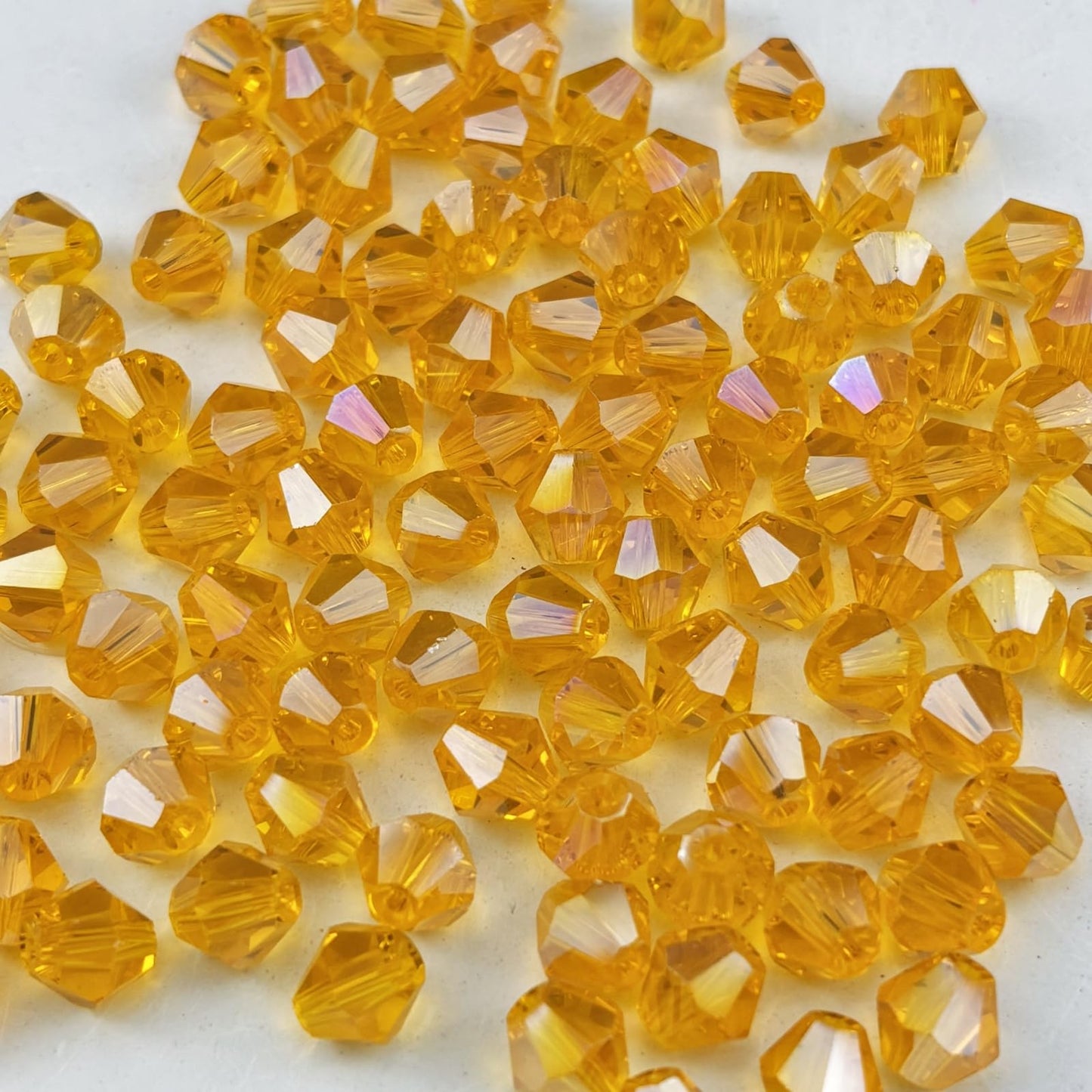 Pinhoollgo 600pcs 3mm Bicone Crystal Glass Beads Faceted Bicone Crystal Beads Bulk Glass Spacer Beads for Bracelets Necklace Pendants Earrings DIY Jewelry Craft Making(Orange AB)
