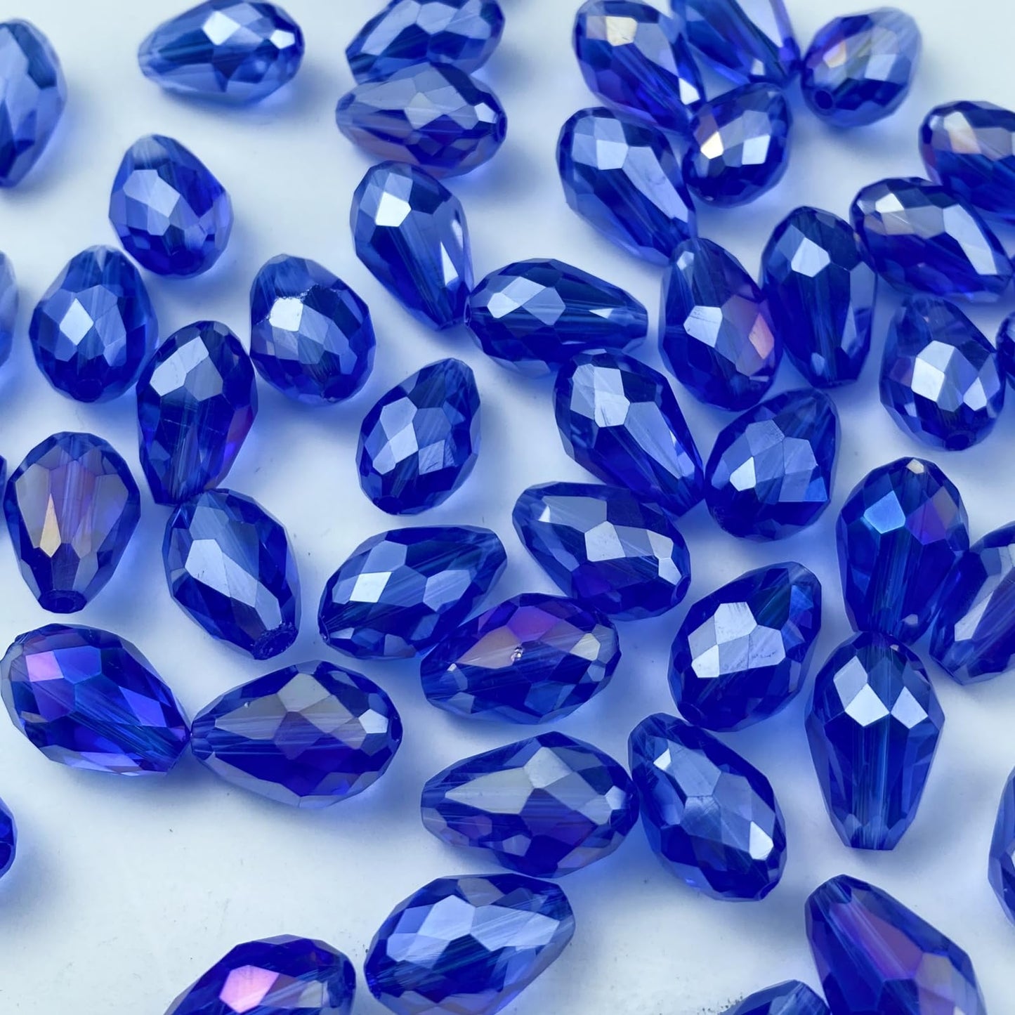 Honkoolly 130pcs 6x8mm Teardrop Crystal Glass Beads Vertical Hole Faceted Glass Teardrop Spacer Beads for Bracelets Necklace Earring DIY Jewelry Making Craft(Blue AB)