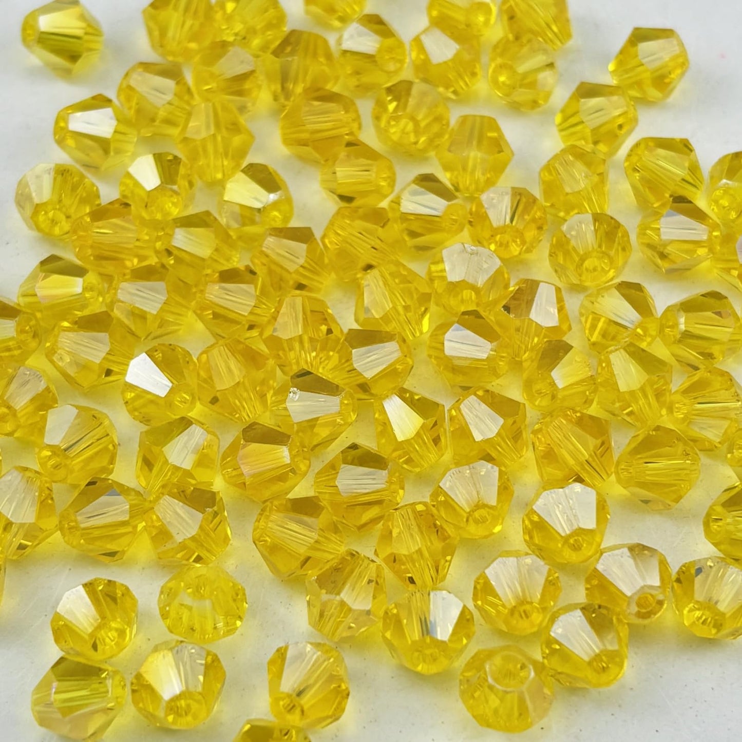 Pinhoollgo 100pcs 8mm Bicone Crystal Glass Beads Faceted Bicone Crystal Beads Bulk Glass Spacer Beads for Bracelets Necklace Pendants Earrings DIY Jewelry Craft Making(Gold Yellow AB)