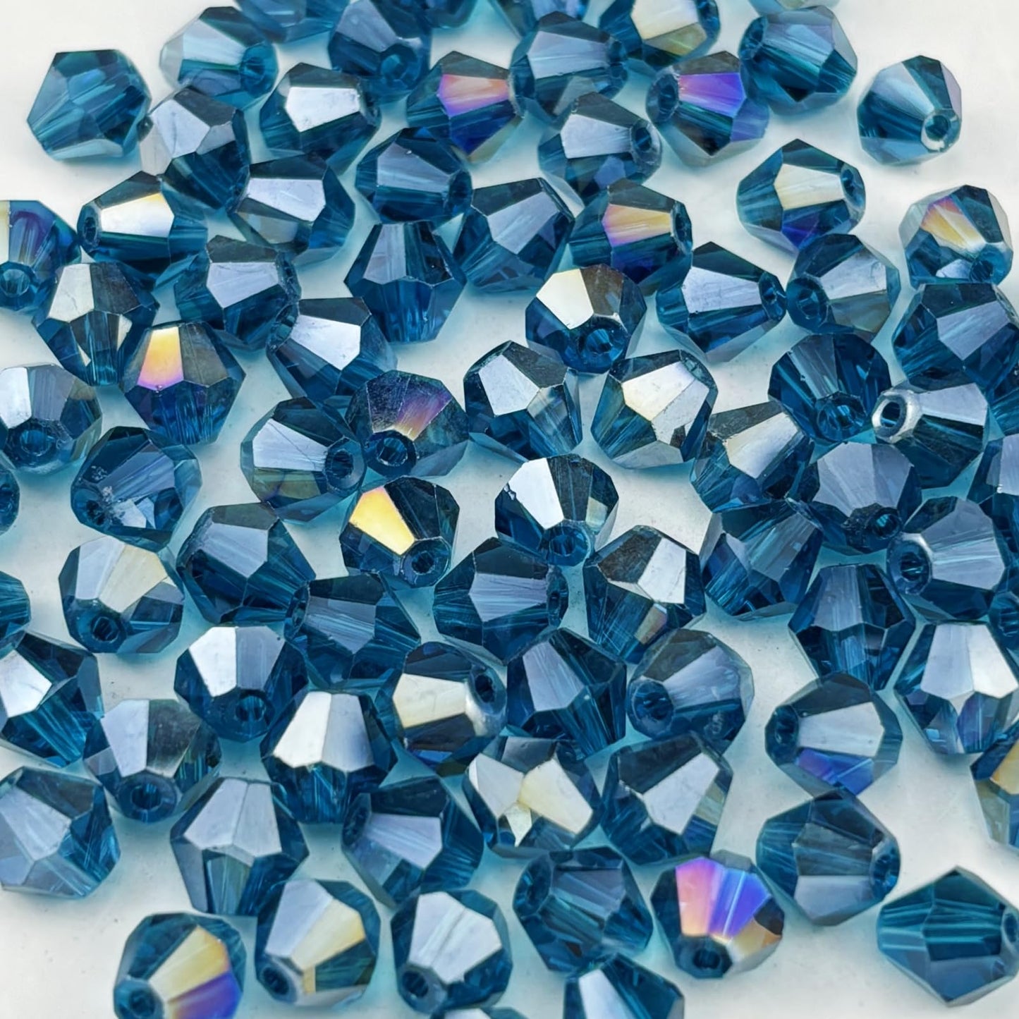 Pinhoollgo 500pcs 4mm Bicone Crystal Glass Beads Faceted Bicone Crystal Beads Bulk Glass Spacer Beads for Bracelets Necklace Pendants Earrings DIY Jewelry Craft Making(Peacock Blue AB)
