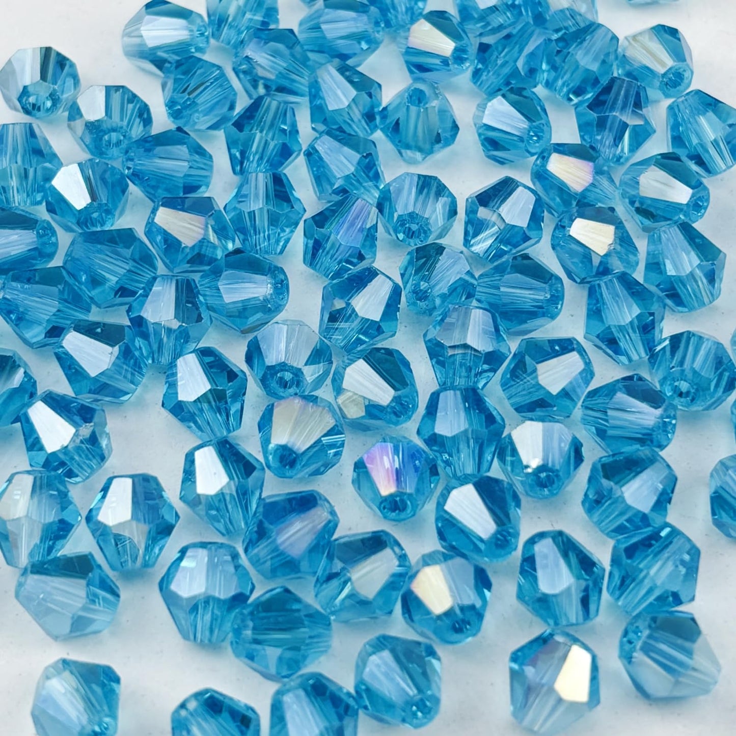 Pinhoollgo 100pcs 8mm Bicone Crystal Glass Beads Faceted Bicone Crystal Beads Bulk Glass Spacer Beads for Bracelets Necklace Pendants Earrings DIY Jewelry Craft Making(Lake Blue AB)